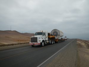 Wind turbine in route to destination with escort